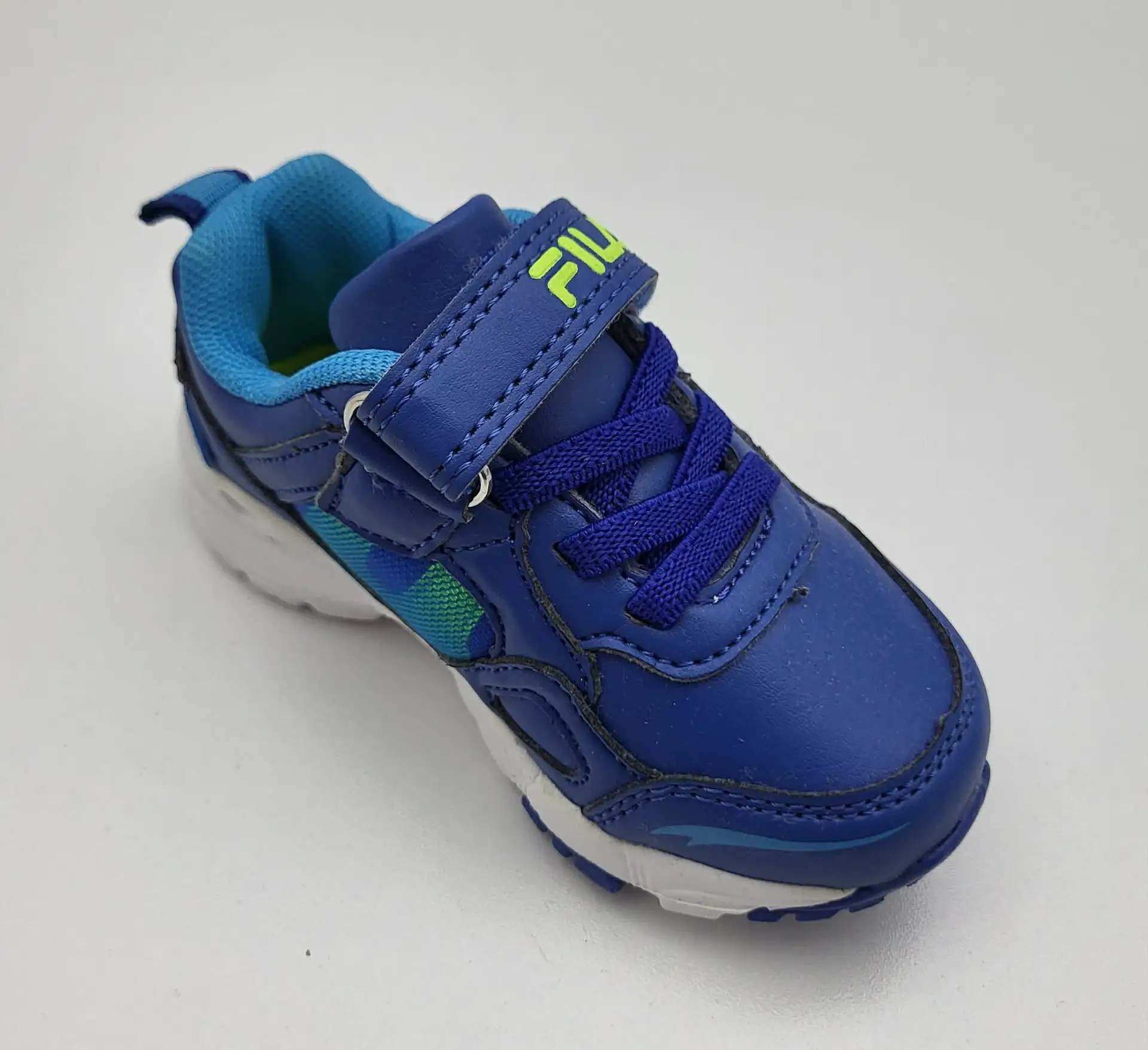 athlitika-papoutsia-agori-fila-royal-blue-green-stripe-details-6